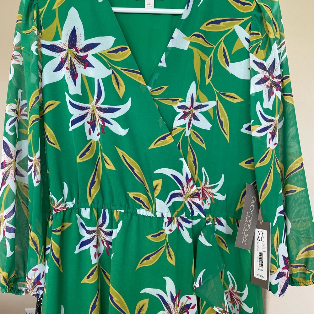 New with tags!  Stunning Eva Mendes green floral dress. Medium size.